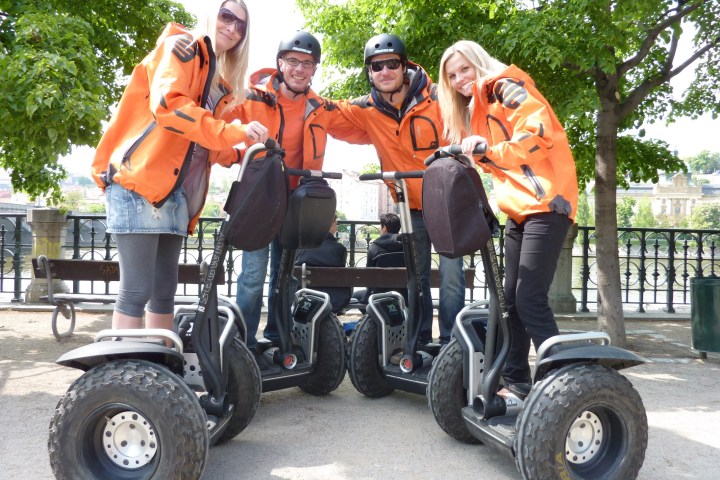 a group of people riding on the back of a truck