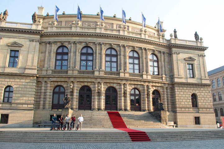 a group of people walking in front of Palazzo Madama, Turin