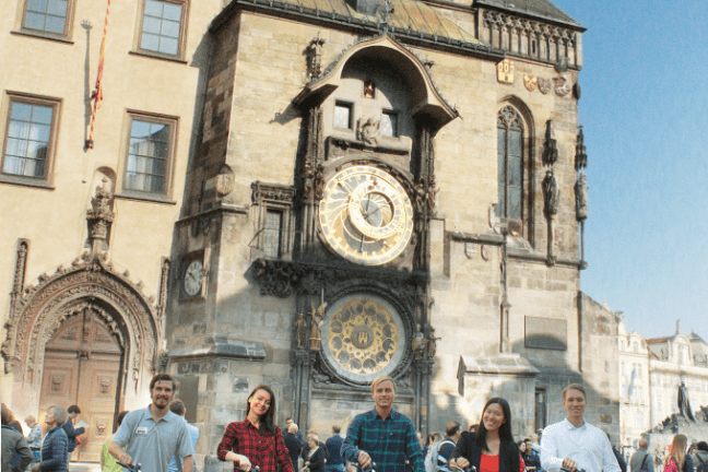 a group of people standing in front of a building