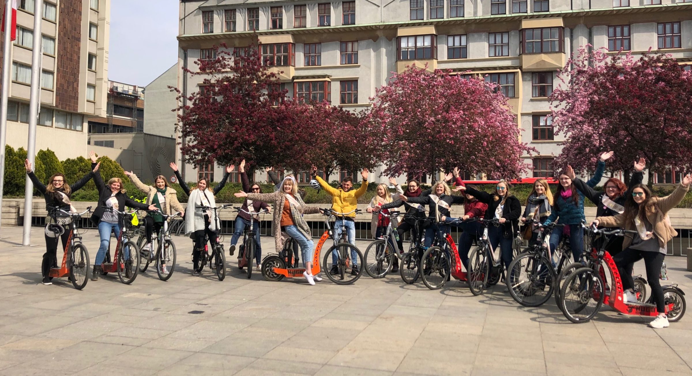 a group of people riding on the back of a bicycle