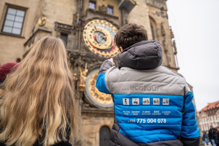 a person sitting in front of a building