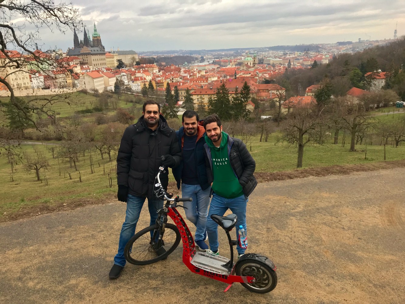 a group of people standing around a motorcycle