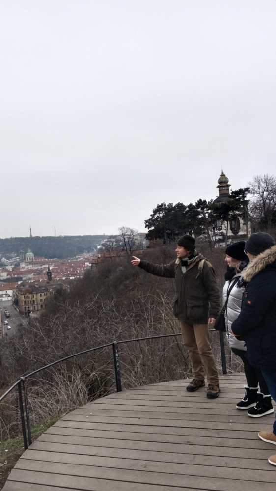a group of people walking on a bridge
