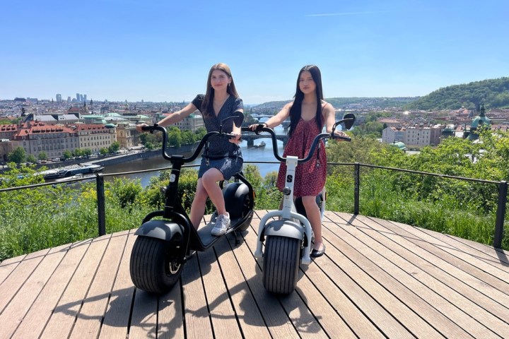 a person standing next to a fence